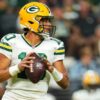 Packers qb jordan love helps fan out of snow drift during blizzard